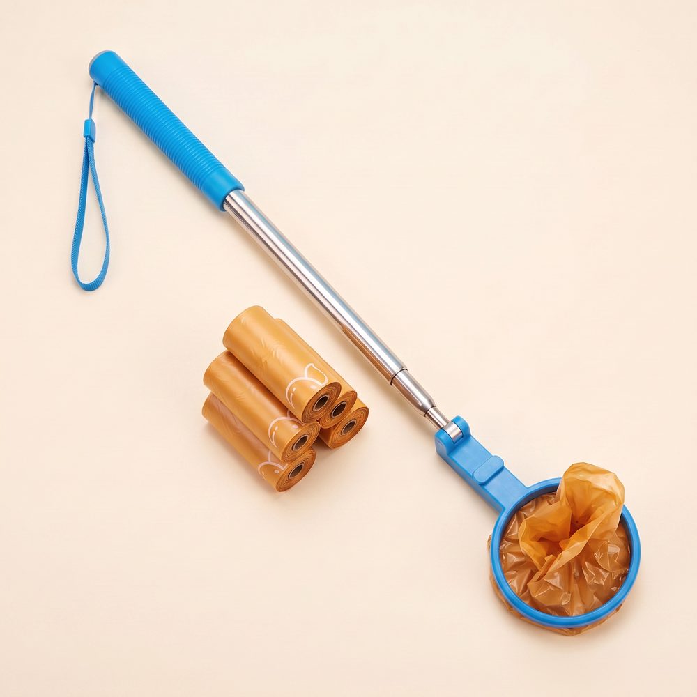 The DogPoopCatcher with orange scented refill rolls